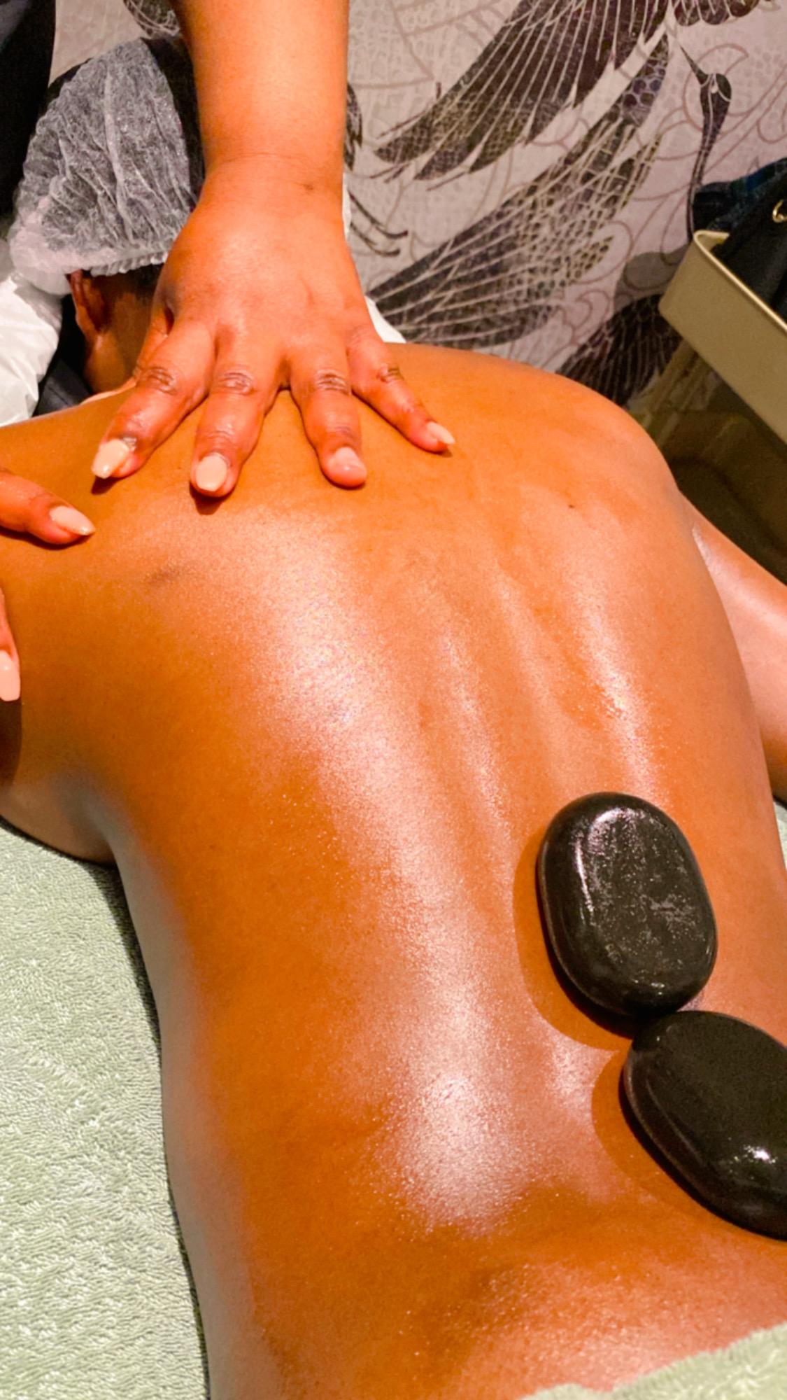 Hot stone massage therapy with heated stones